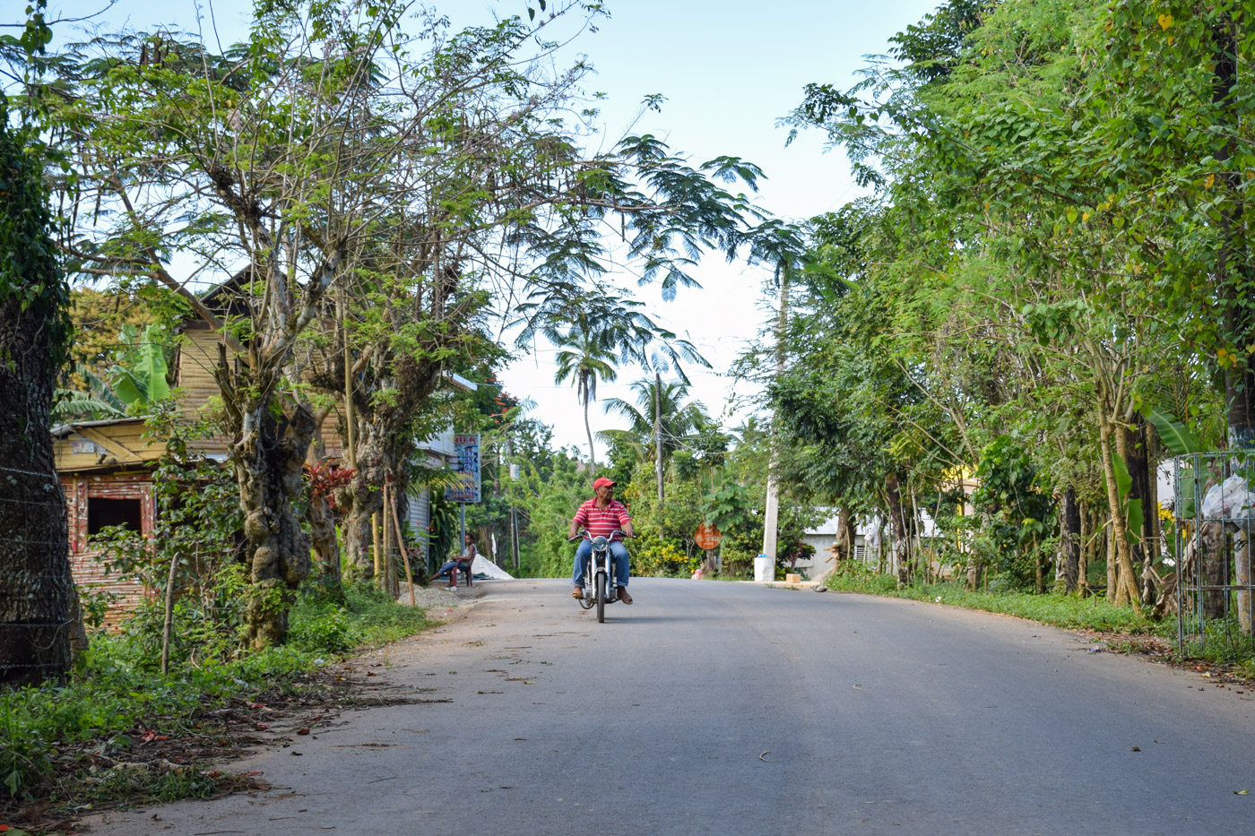 Fisherman driving his motorcycle in El Valle's only road