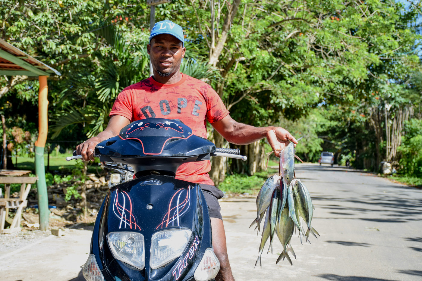 Fisherman arriving with fish at the village