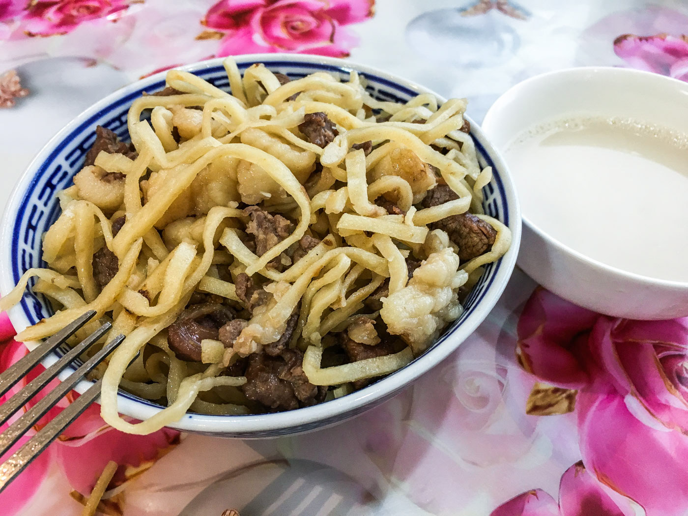 Tsuivan is a noodle dish that is usually prepared with mutton and vegetables. Here served with airag.